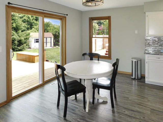 1637 Old Field Ct, Rockton, IL 61072 - dining room featuring plenty of natural light, a chandelier, and dark wood finished floors