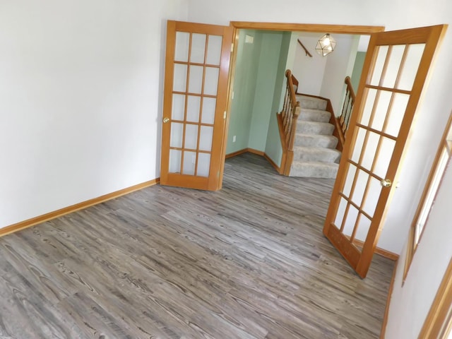 1637 Old Field Ct, Rockton, IL 61072 - spare room with wood finished floors, stairway, and french doors