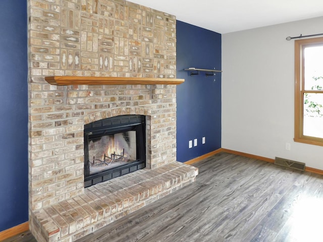1637 Old Field Ct, Rockton, IL 61072 - unfurnished living room featuring wood finished floors and a fireplace
