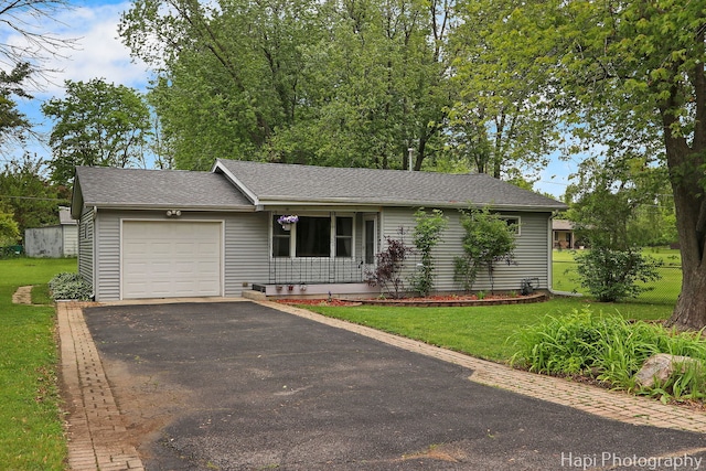 12112 W Bonnie Brook Ln, Beach Park, IL 60087 - single story home featuring a garage, a front yard, driveway, a shingled roof, and covered porch