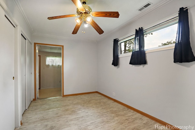 12112 W Bonnie Brook Ln, Beach Park, IL 60087 - unfurnished bedroom featuring multiple windows, light wood-type flooring, crown molding, and ceiling fan