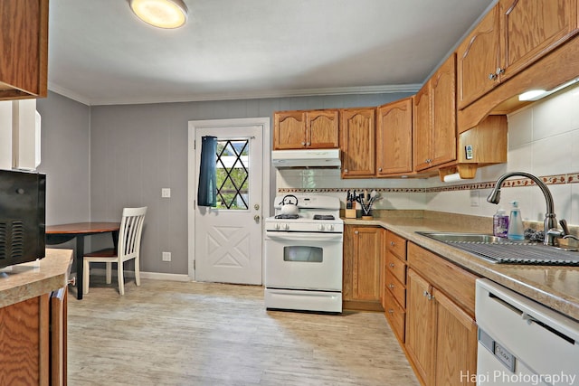 12112 W Bonnie Brook Ln, Beach Park, IL 60087 - kitchen with white appliances, under cabinet range hood, crown molding, light wood finished floors, and brown cabinets