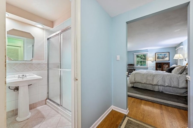 2810 Beckwith Ct, Northbrook, IL 60062 - bedroom featuring tile walls and light wood-style floors
