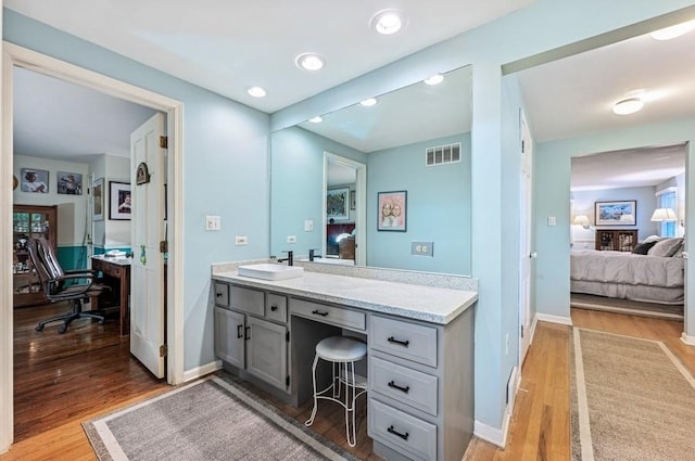 2810 Beckwith Ct, Northbrook, IL 60062 - ensuite bathroom with wood finished floors, vanity, and recessed lighting