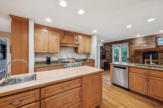 2810 Beckwith Ct, Northbrook, IL 60062 - kitchen featuring dishwasher, premium range hood, stove, light wood-type flooring, and wooden counters