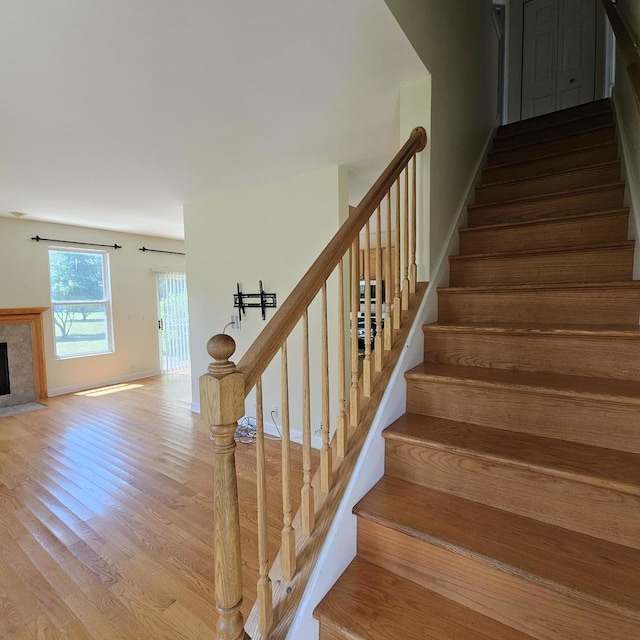 4029 Boulder Ct, Aurora, IL 60504 - stairs with wood finished floors and a tile fireplace