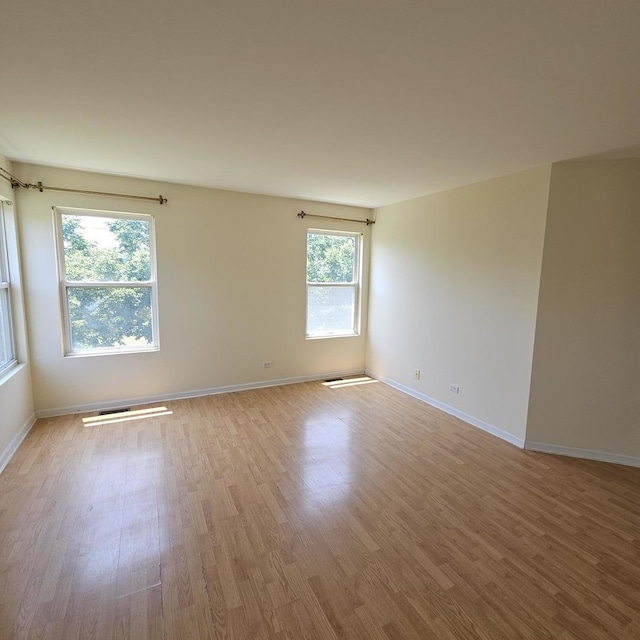4029 Boulder Ct, Aurora, IL 60504 - empty room with wood finished floors and baseboards