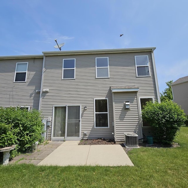 4029 Boulder Ct, Aurora, IL 60504 - back of property with a lawn and a patio