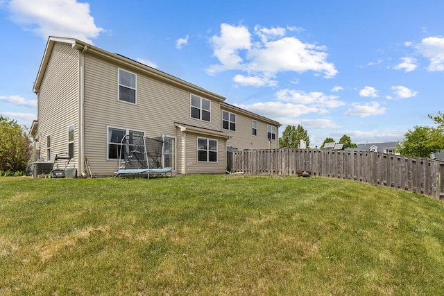 1929 Diamond Head Trl, Pingree Grove, IL 60140 - back of house with a trampoline and a fenced backyard