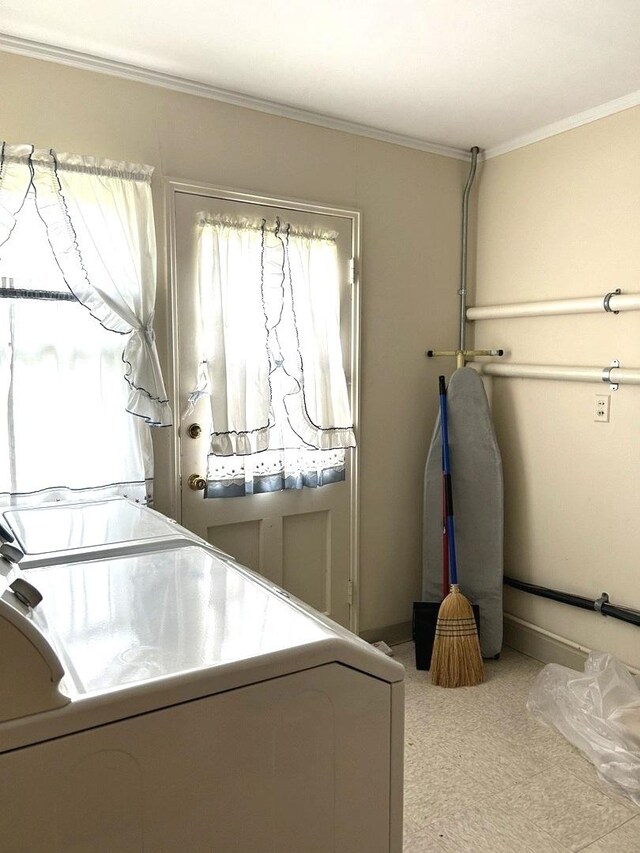 1415 Lakewood Dr, Mendota, IL 61342 - laundry room featuring washing machine and dryer, crown molding, and carpet flooring