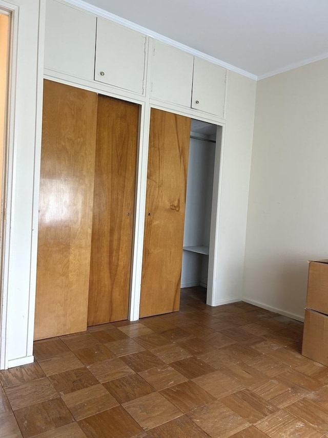 1415 Lakewood Dr, Mendota, IL 61342 - unfurnished bedroom with crown molding and baseboards
