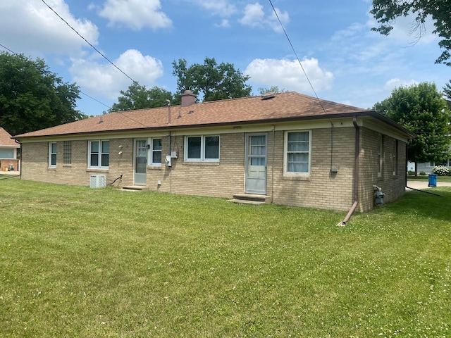 1415 Lakewood Dr, Mendota, IL 61342 - rear view of house featuring a yard and brick siding