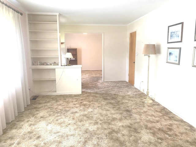 1415 Lakewood Dr, Mendota, IL 61342 - carpeted spare room featuring crown molding