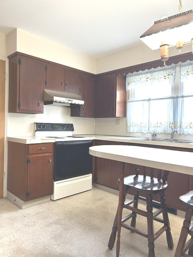 1415 Lakewood Dr, Mendota, IL 61342 - kitchen with electric range, exhaust hood, light countertops, and light flooring