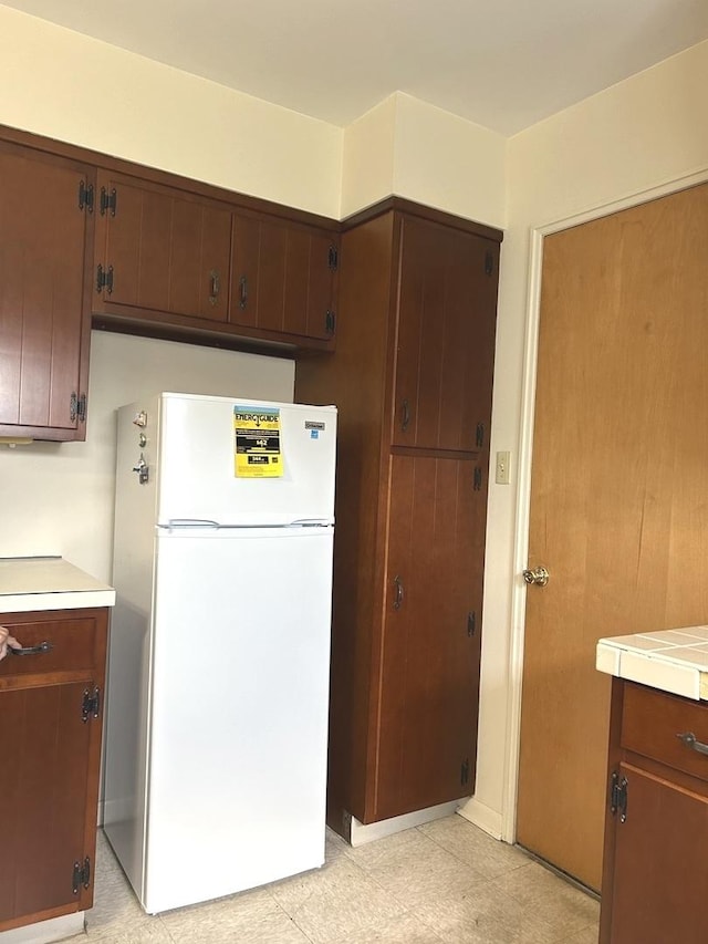 1415 Lakewood Dr, Mendota, IL 61342 - kitchen with freestanding refrigerator and light countertops