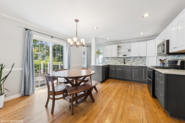 220 E Elm St, Wheaton, IL 60189 - kitchen with appliances with stainless steel finishes, a chandelier, white cabinets, gray cabinetry, and recessed lighting