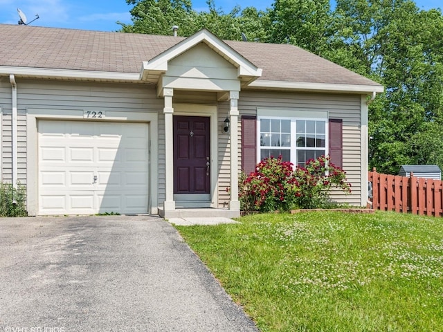 722 Eberly Ct, Plano, IL 60545 - view of front of house with an attached garage, asphalt driveway, and roof with shingles