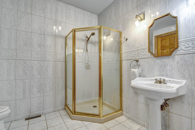 1383 Gordon Ln, Lemont, IL 60439 - full bathroom with tile walls, tile patterned flooring, and a stall shower