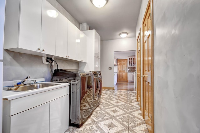 1383 Gordon Ln, Lemont, IL 60439 - laundry area with cabinet space, washer / dryer, and light tile patterned flooring