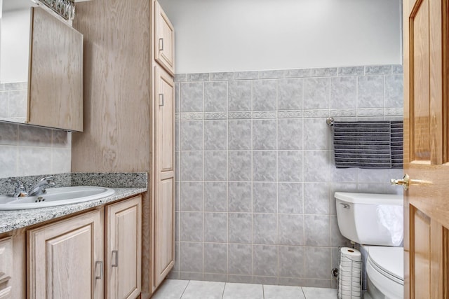 1383 Gordon Ln, Lemont, IL 60439 - bathroom with tile walls, vanity, and tile patterned flooring