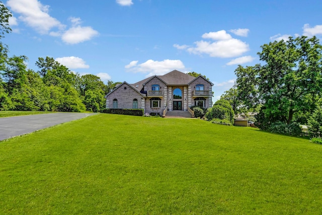 1383 Gordon Ln, Lemont, IL 60439 - french provincial home with stone siding, a front lawn, and asphalt driveway