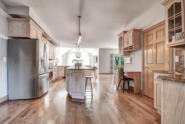 1383 Gordon Ln, Lemont, IL 60439 - kitchen featuring appliances with stainless steel finishes, a kitchen breakfast bar, glass insert cabinets, and wood finished floors