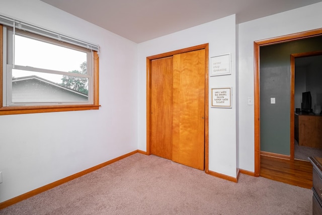 14194 Kennedy Dr, South Beloit, IL 61080 - unfurnished bedroom featuring carpet floors and a closet