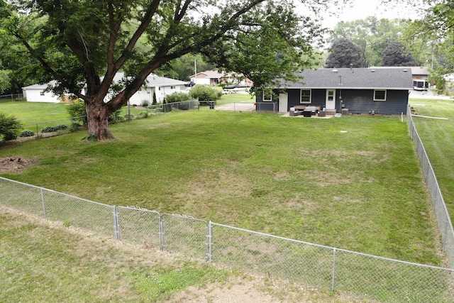 14194 Kennedy Dr, South Beloit, IL 61080 - fenced backyard with a patio area and an outdoor living space