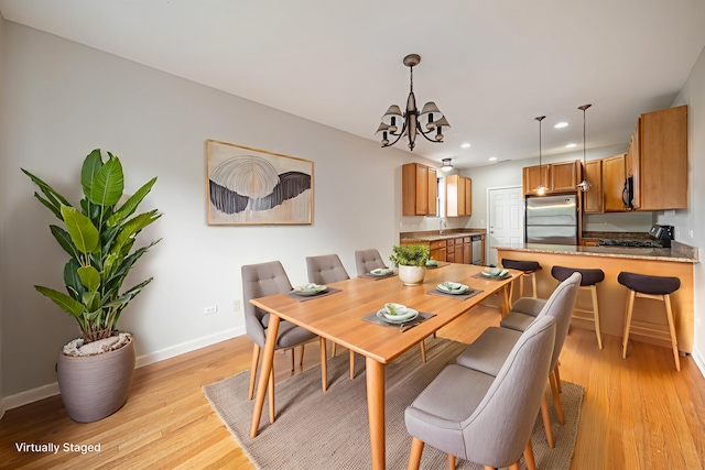 6829 N Lakewood Ave Unit 3, Chicago, IL 60626 - dining space featuring a chandelier, light wood-type flooring, and recessed lighting