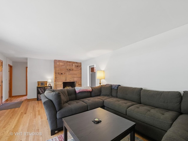 3004 Blarneystone Ln, Cary, IL 60013 - living area with light wood-type flooring and a fireplace