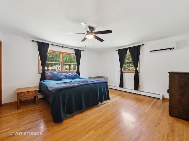 3004 Blarneystone Ln, Cary, IL 60013 - bedroom featuring baseboard heating, a wall mounted AC, light wood finished floors, and a ceiling fan