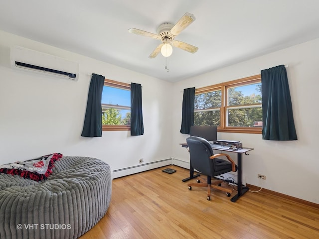 3004 Blarneystone Ln, Cary, IL 60013 - office area featuring a baseboard heating unit, a wall unit AC, plenty of natural light, and light wood-type flooring