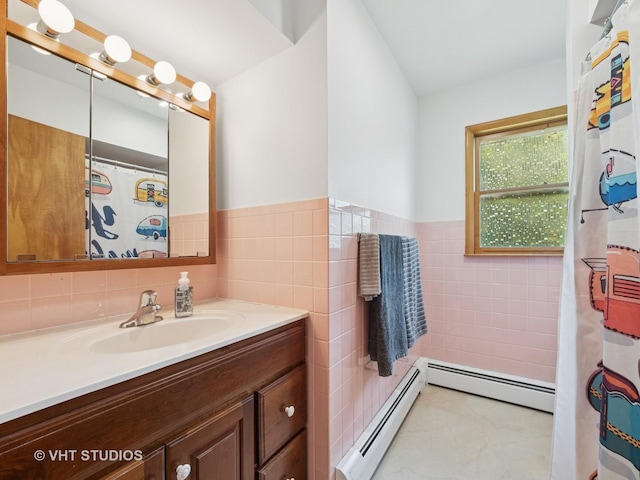 3004 Blarneystone Ln, Cary, IL 60013 - bathroom with a baseboard heating unit, tile walls, vanity, and wainscoting