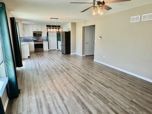 1389 Clifton Ave, Beecher, IL 60401 - unfurnished living room featuring light wood-style floors and ceiling fan