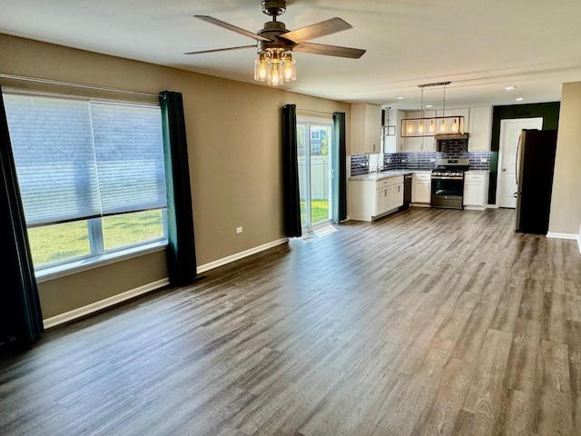 1389 Clifton Ave, Beecher, IL 60401 - kitchen featuring stainless steel appliances, backsplash, plenty of natural light, light countertops, and recessed lighting