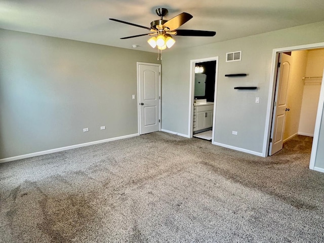 1389 Clifton Ave, Beecher, IL 60401 - unfurnished bedroom with carpet, ensuite bath, ceiling fan, and a walk in closet