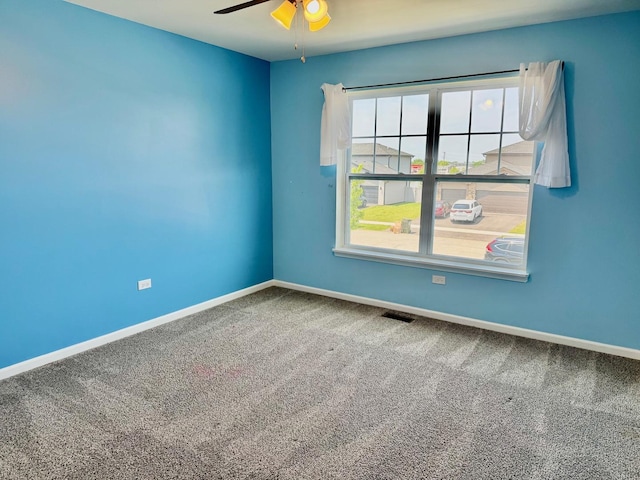 1389 Clifton Ave, Beecher, IL 60401 - spare room with a ceiling fan and carpet floors