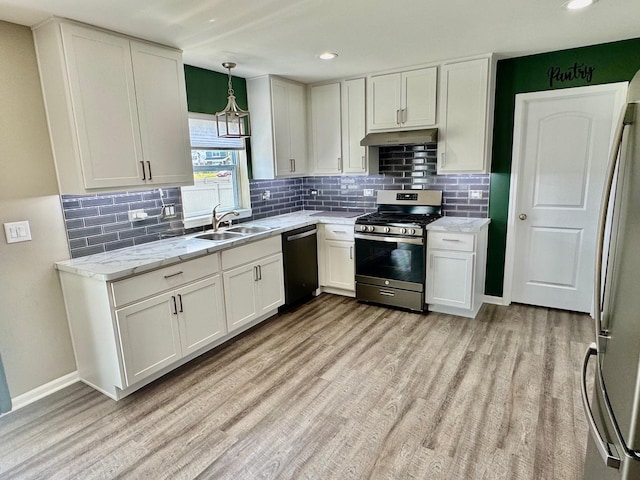 1389 Clifton Ave, Beecher, IL 60401 - kitchen with stainless steel appliances, under cabinet range hood, light wood-style floors, decorative backsplash, and recessed lighting