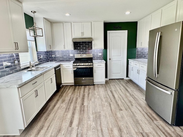 1389 Clifton Ave, Beecher, IL 60401 - kitchen featuring appliances with stainless steel finishes, light wood-style floors, tasteful backsplash, white cabinets, and recessed lighting