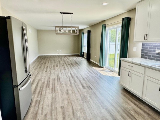 1389 Clifton Ave, Beecher, IL 60401 - unfurnished dining area featuring light wood-style floors and recessed lighting