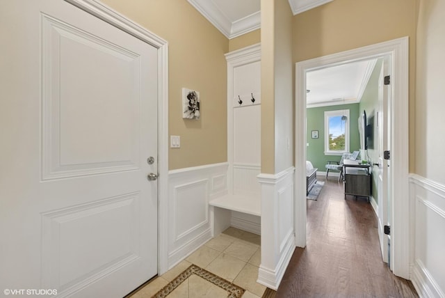 3252 N California Ave Unit 2, Chicago, IL 60618 - mudroom with crown molding, a decorative wall, and a wainscoted wall