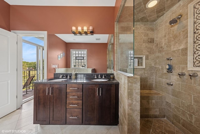 3252 N California Ave Unit 2, Chicago, IL 60618 - bathroom featuring walk in shower, double vanity, and tile patterned floors