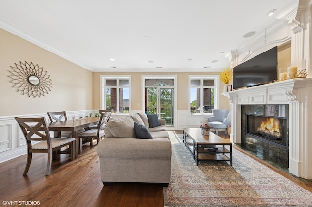 3252 N California Ave Unit 2, Chicago, IL 60618 - living room with a premium fireplace, a decorative wall, crown molding, dark wood-style floors, and a wainscoted wall