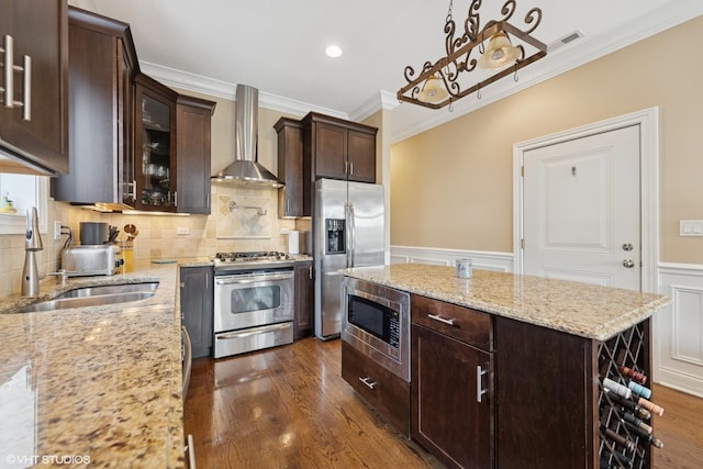 3252 N California Ave Unit 2, Chicago, IL 60618 - kitchen with appliances with stainless steel finishes, wall chimney exhaust hood, crown molding, dark wood-type flooring, and a center island