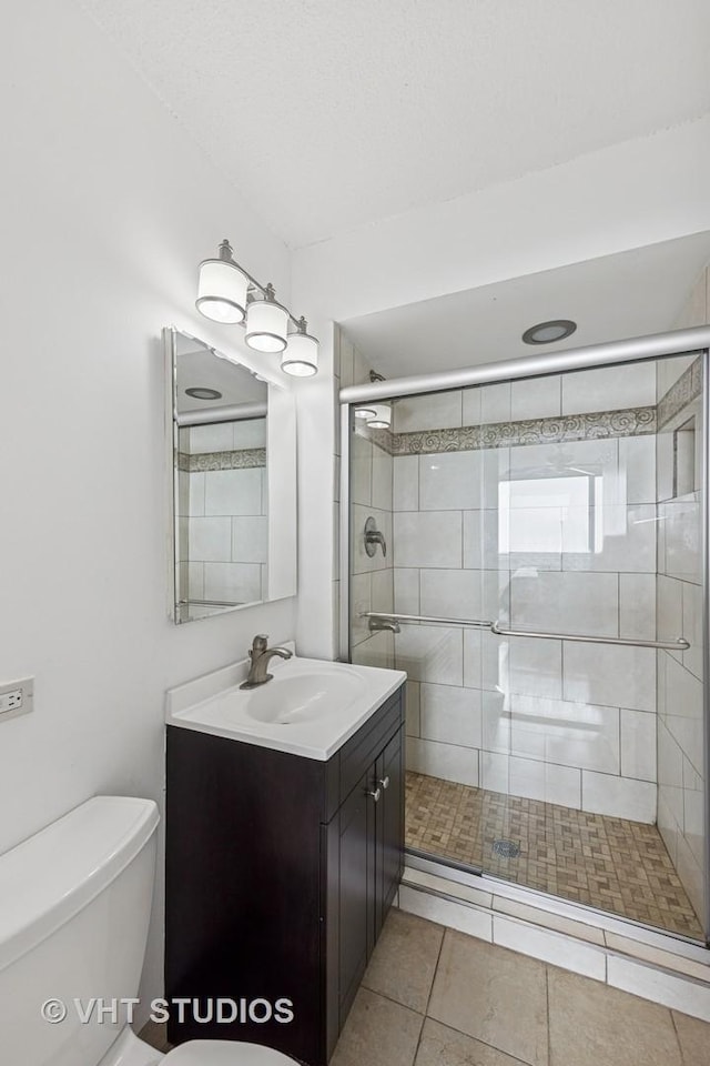 2144 N Lincoln Park W Unit 23B, Chicago, IL 60614 - bathroom featuring vanity, a shower stall, and tile patterned flooring