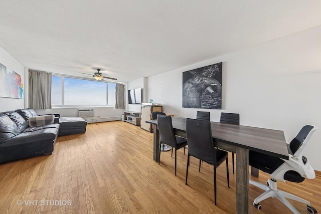 2144 N Lincoln Park W Unit 23B, Chicago, IL 60614 - dining room with light wood-style floors, a baseboard heating unit, ceiling fan, and a wall mounted air conditioner