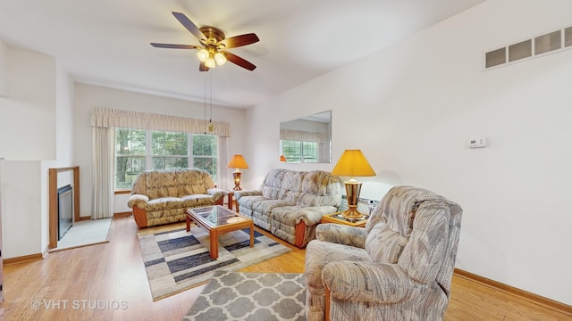 832 Veridian Way Unit 832, Cary, IL 60013 - living area featuring plenty of natural light, a ceiling fan, a fireplace, and light wood-style flooring