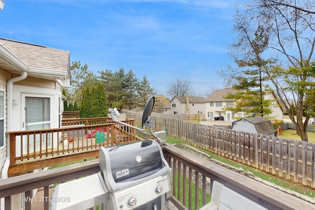 832 Veridian Way Unit 832, Cary, IL 60013 - wooden terrace featuring a fenced backyard, a grill, a storage shed, and a residential view