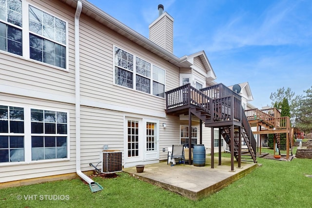 832 Veridian Way Unit 832, Cary, IL 60013 - rear view of house featuring stairway, a wooden deck, a patio area, a chimney, and a yard