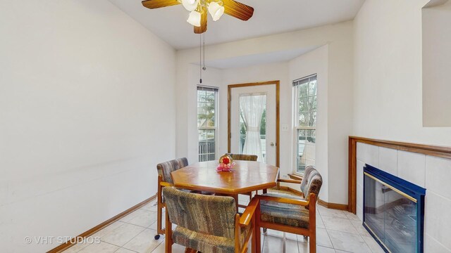 832 Veridian Way Unit 832, Cary, IL 60013 - dining space featuring plenty of natural light, light tile patterned floors, a tiled fireplace, and ceiling fan